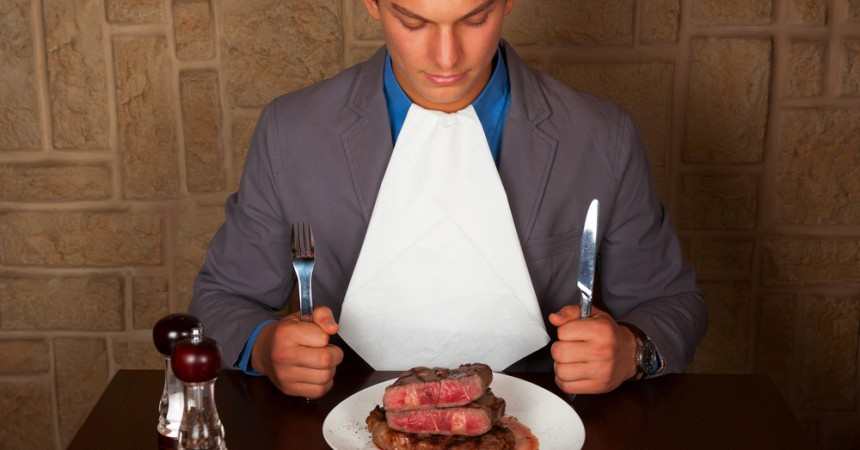man eating meat